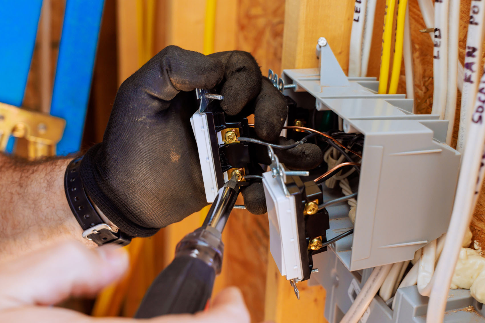 Installing electrical switches in a residential setting during a home renovation project